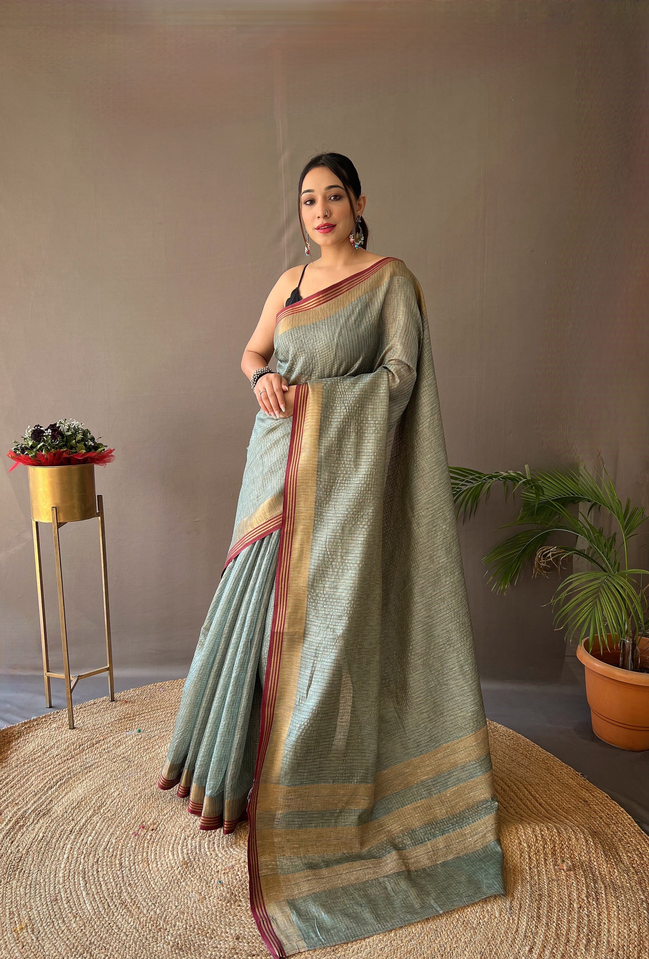 Green Timeless Soft Silk Zari Chex Weaving Saree With Contrast Border.