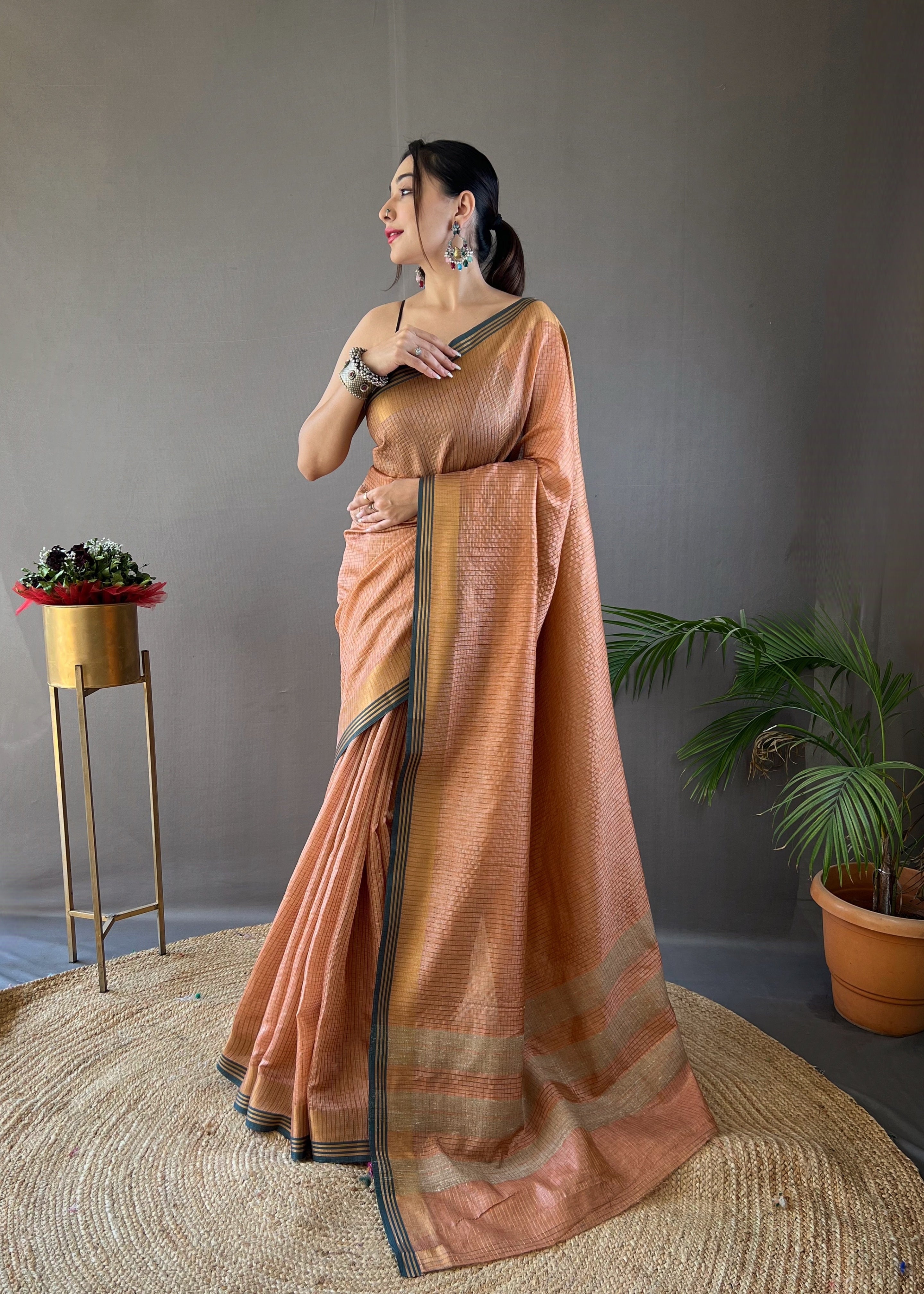 Peach Timeless Soft Silk Zari Chex Weaving Saree With Contrast Border.